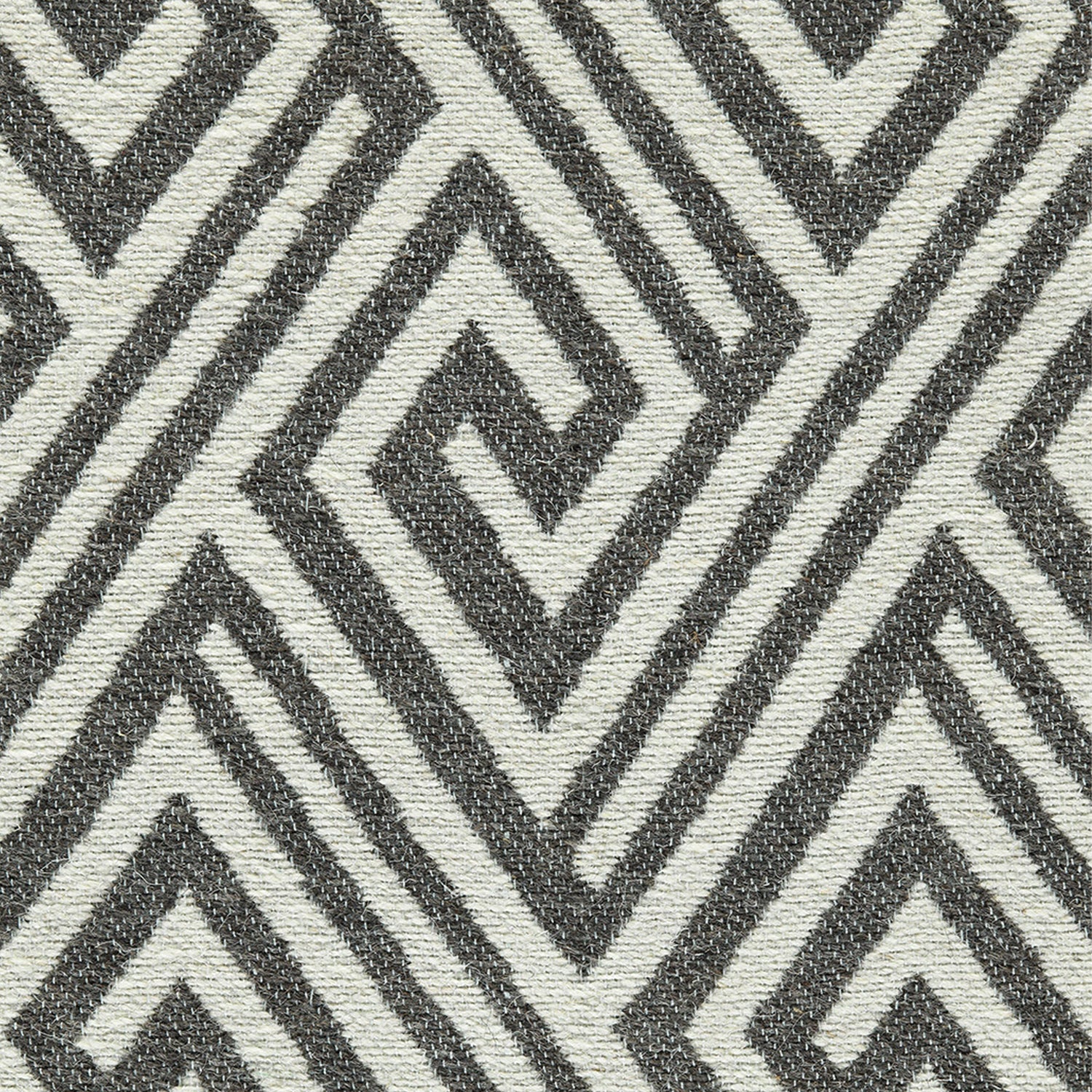 Wool-blend broadloom carpet swatch in an interlocking linear diamond pattern in cream and charcoal.