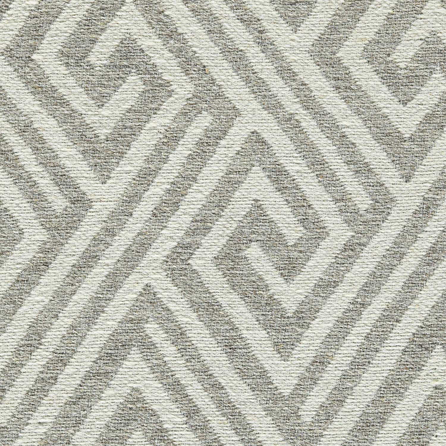 Wool-blend broadloom carpet swatch in an interlocking linear diamond pattern in cream and silver.