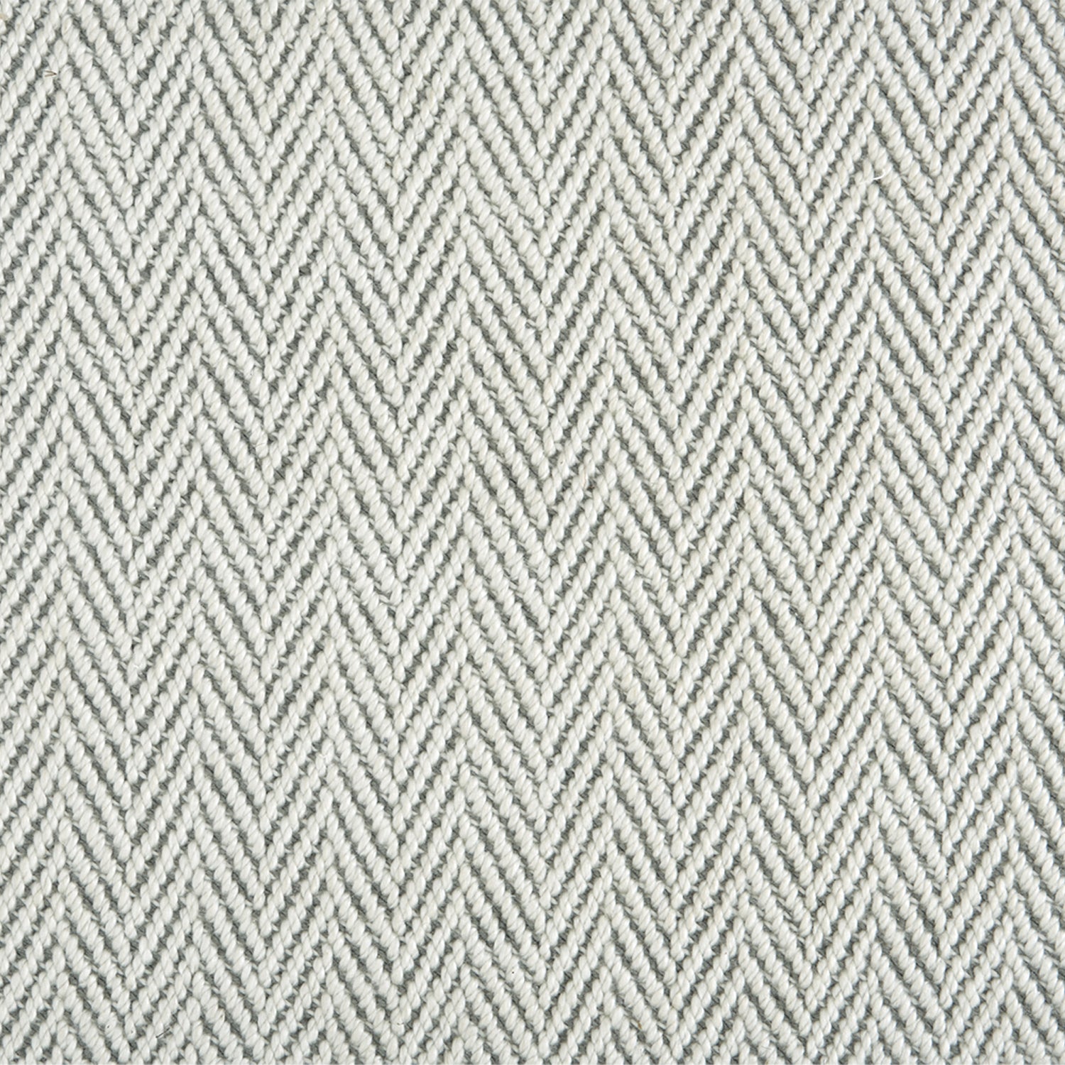 Nylon broadloom carpet swatch in a textured herringbone weave in mottled white and gray.