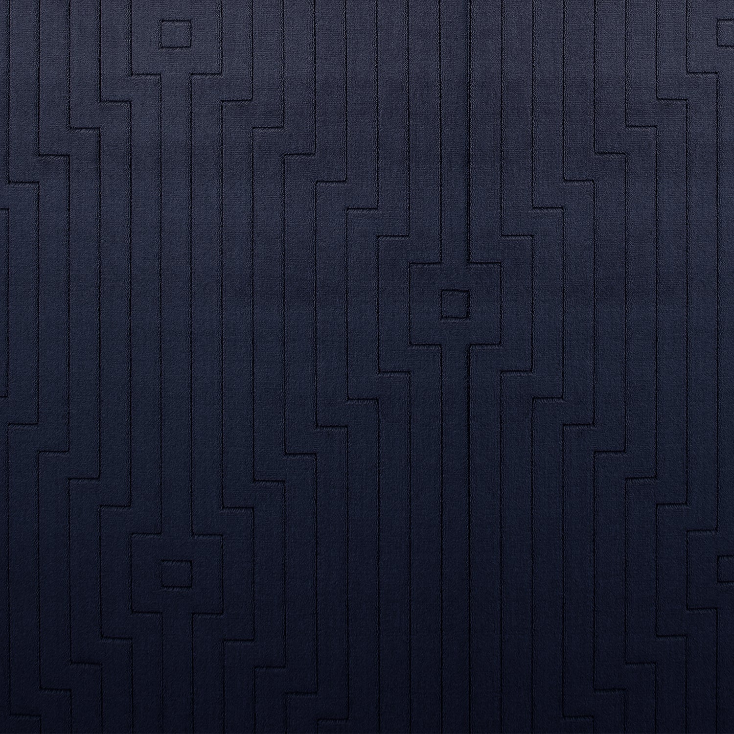 Wool-silk broadloom carpet swatch in a dimensional geometric weave in navy.
