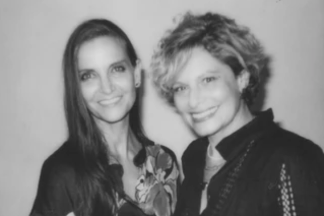 Black and white portrait of two women smiling women