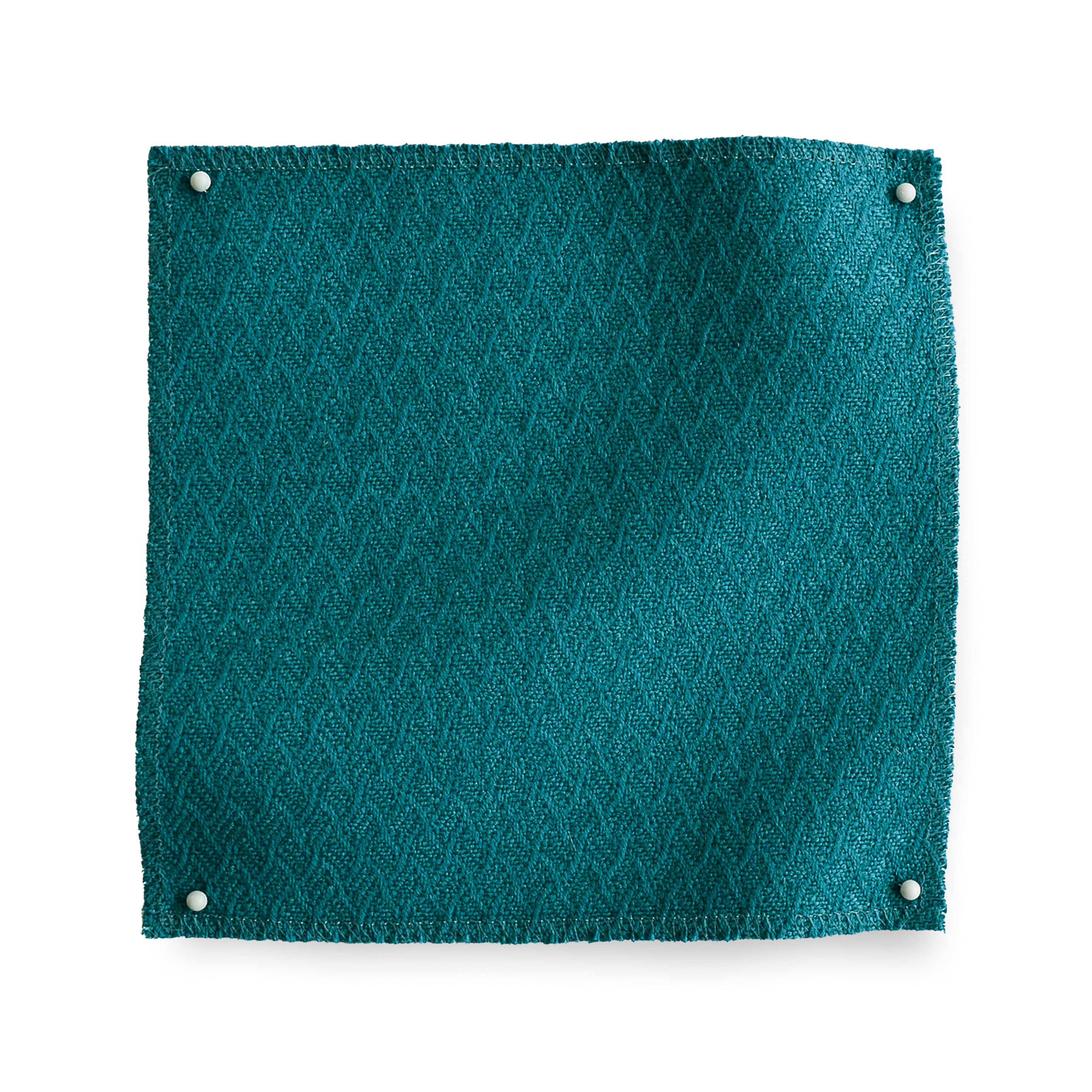 Wool trellis jacquard swatch pinned in all corners in teal