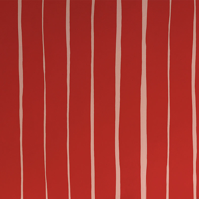 Detail of wallpaper in a playful irregular stripe print in cream on a red field.