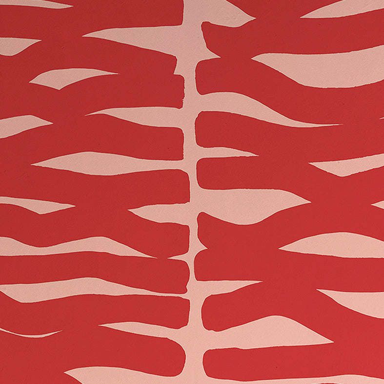 Detail of wallpaper in an abstract zigzag pattern in red on a light pink field.