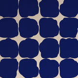 Detail of wallpaper in a repeating blot print in navy on a cream field.