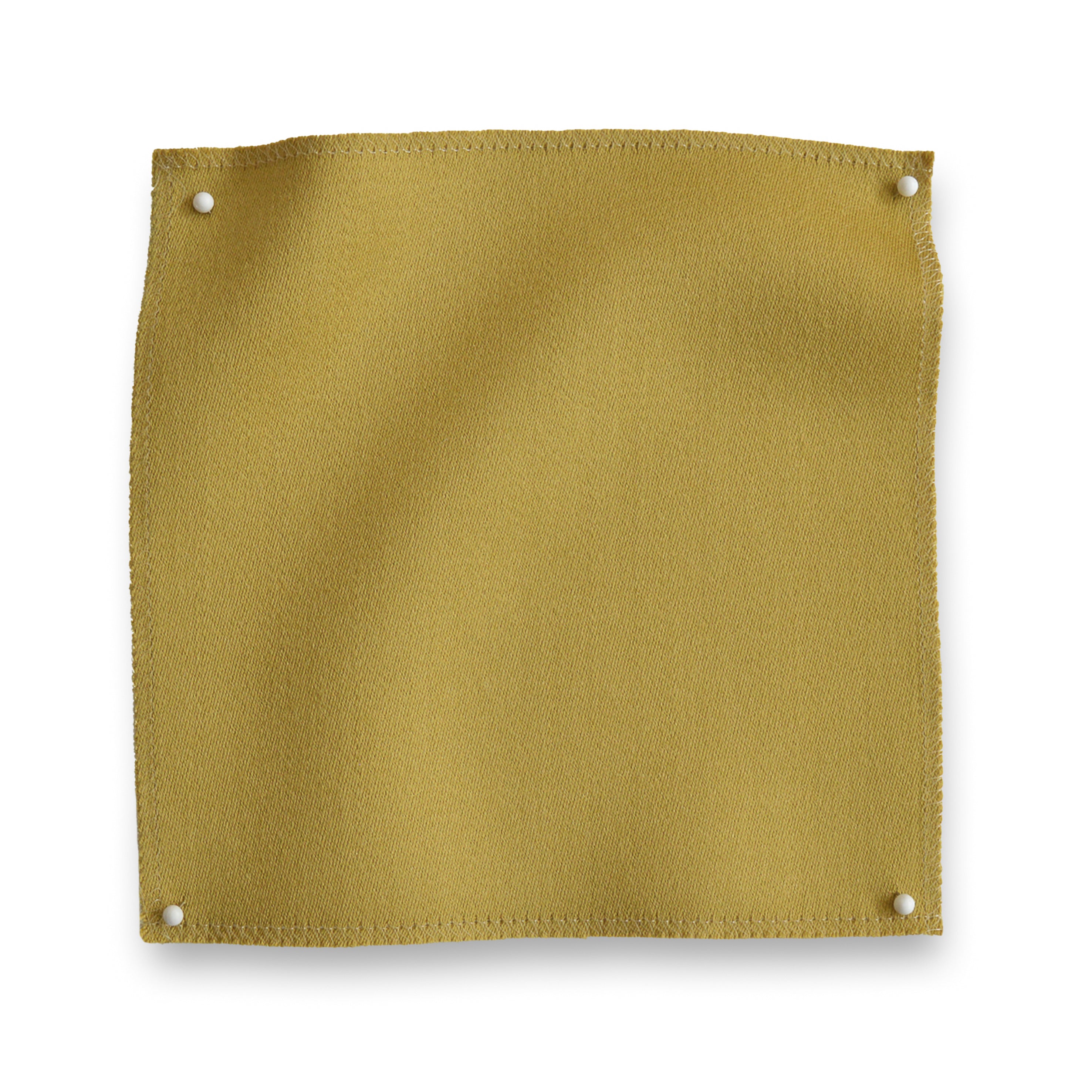 Wool sateen swatch pinned in all corners in yellow