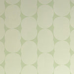 Detail of wallpaper in an abstract curvilinear pattern in cream on a light green field.