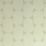 Detail of wallpaper in an abstract curvilinear pattern in cream on a light green field.