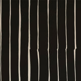 Detail of wallpaper in a playful irregular stripe print in cream on a black field.