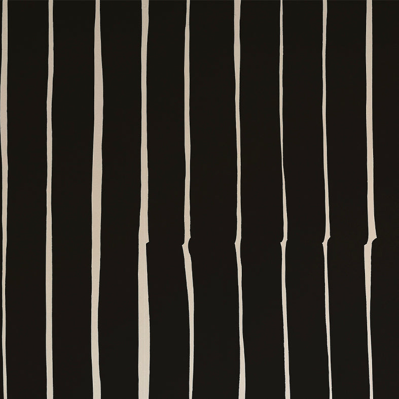 Detail of wallpaper in a playful irregular stripe print in cream on a black field.