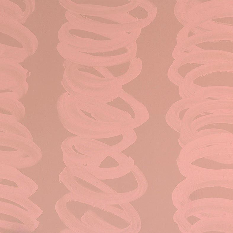 Detail of wallpaper in an abstract scribble print in light pink on a tan field.