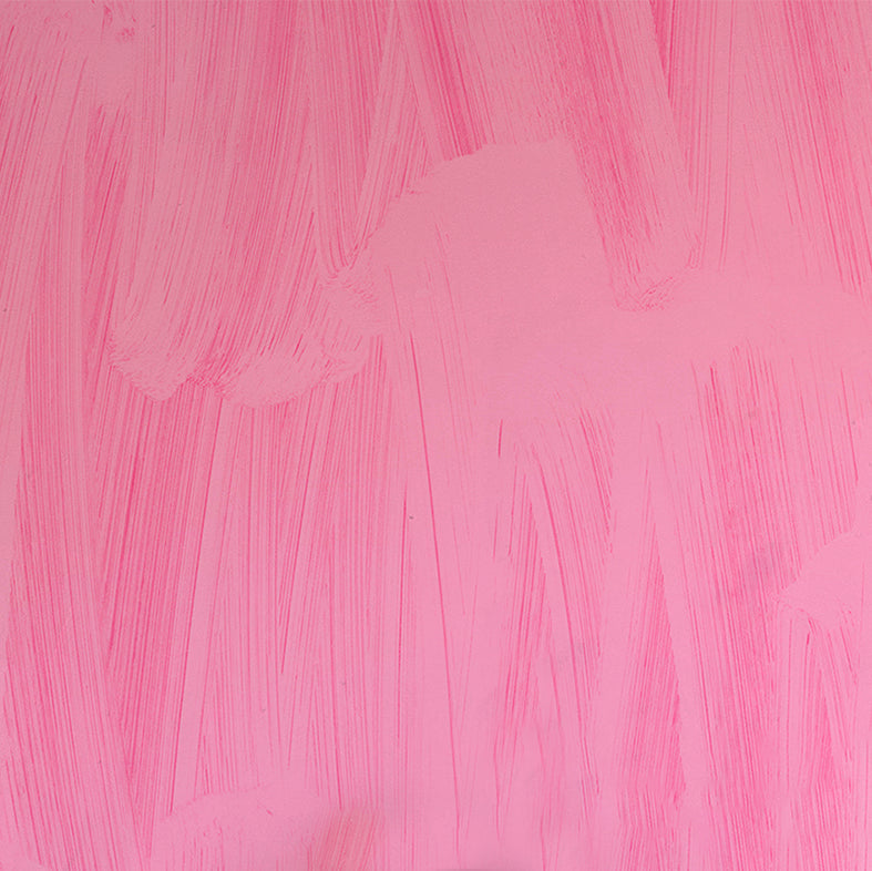 Detail of wallpaper in an abstract paint print in shades of pink.