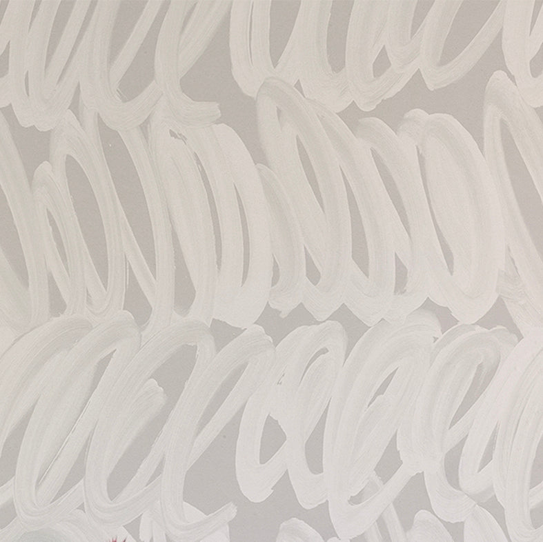 Detail of wallpaper in a playful paint print in cream on a gray field.