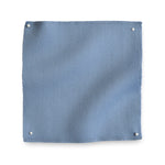 Wool sateen swatch pinned in all corners in cornflower blue