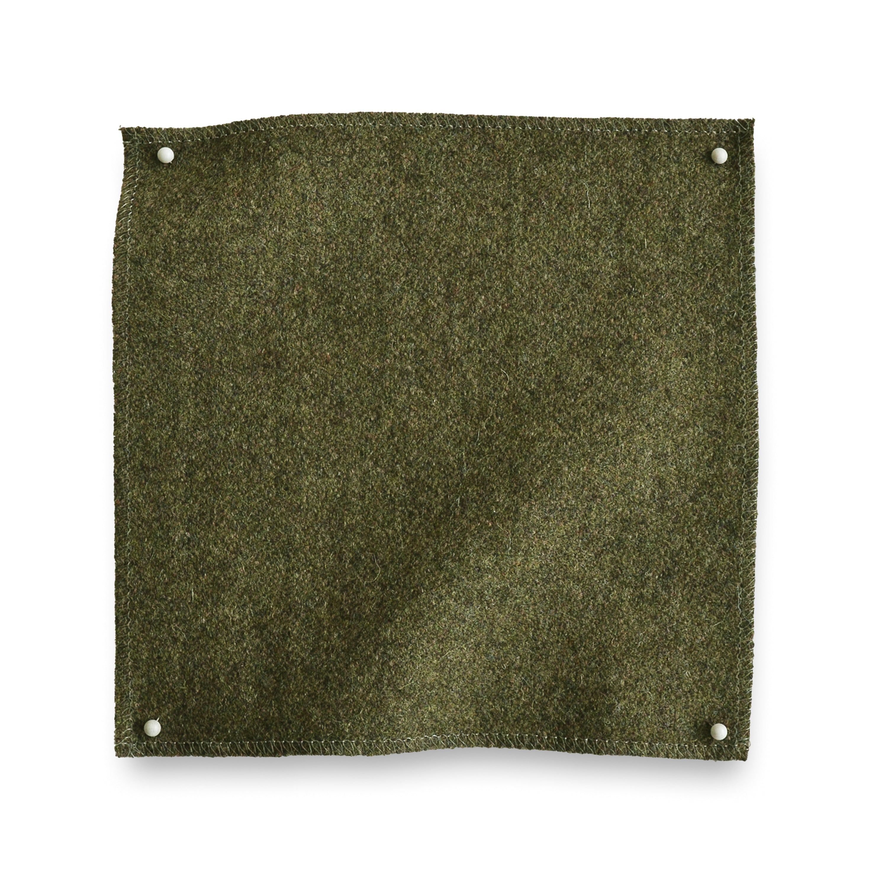 Wool melton swatch pinned in all corners in moss green