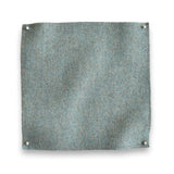 Wool melton swatch pinned in all corners in slate blue