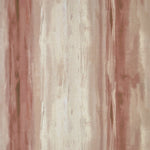 Detail of fabric in an abstract painterly print in shades of rust, pink and cream.