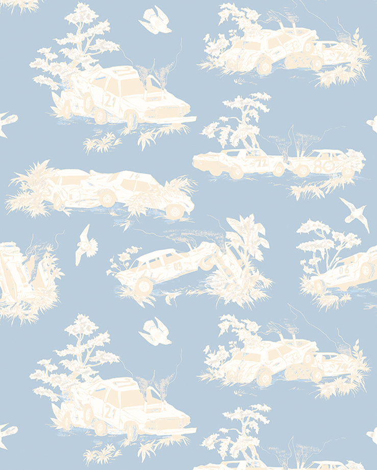 Detail of wallpaper in a playful illustrated car crash print in cream and white on a light blue field.