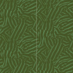 Wallpaper panels in a playful broken stripe print in dark green on a green field.