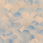 Detail of wallpaper in a repeating scalloped print in shades of blue and tan.