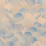 Detail of wallpaper in a repeating scalloped print in shades of blue and tan.