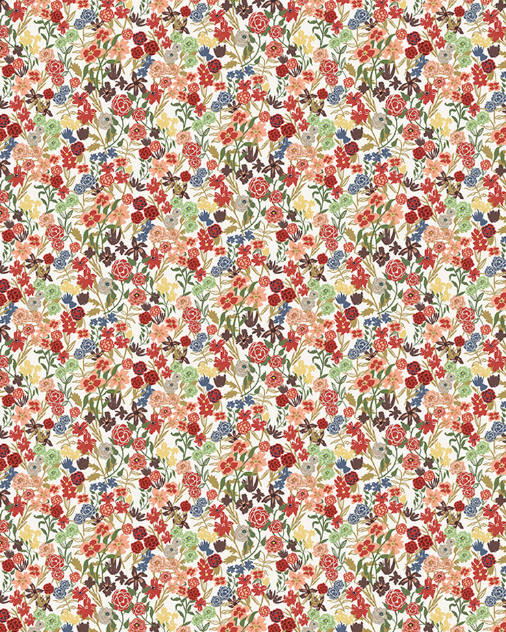 Detail of fabric in a dense small-scale floral print in shades of coral, red, green and blue on a white field.