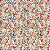 Detail of wallpaper in a dense small-scale floral print in shades of coral, red, green and blue on a white field.