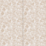 Wallpaper in an abstract paint swatch print in tan on a cream field.