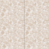 Wallpaper in an abstract paint swatch print in tan on a cream field.