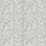 Wallpaper in an abstract paint swatch print in light blue on a tan field.