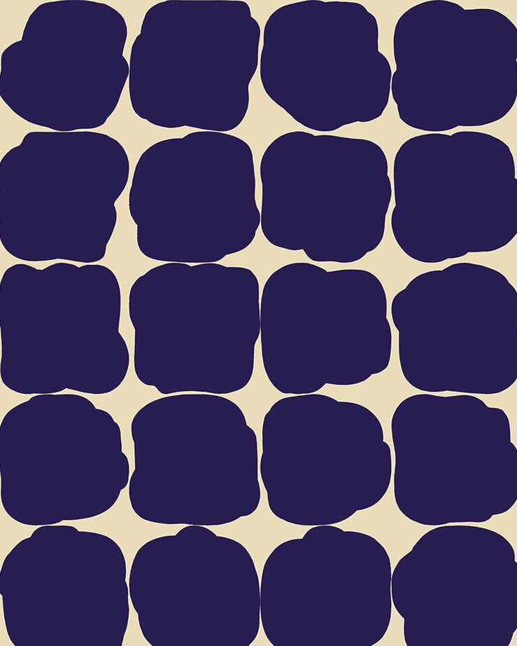 Detail of wallpaper in a repeating blot print in dark blue on a cream field.