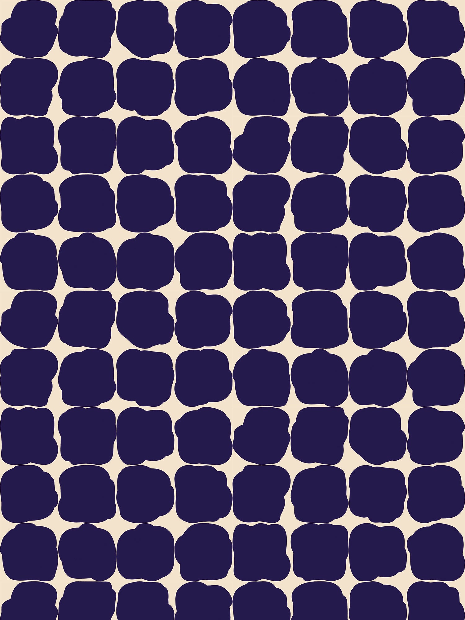 Wallpaper in a repeating blot print in dark blue on a cream field.