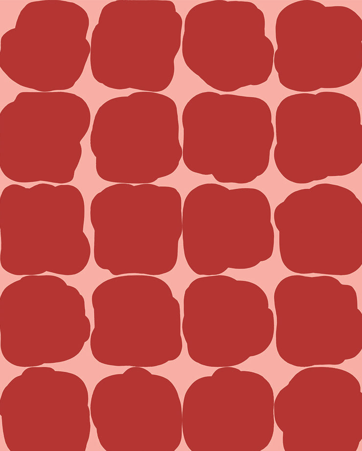 Detail of wallpaper in a repeating blot print in red on a pink field.