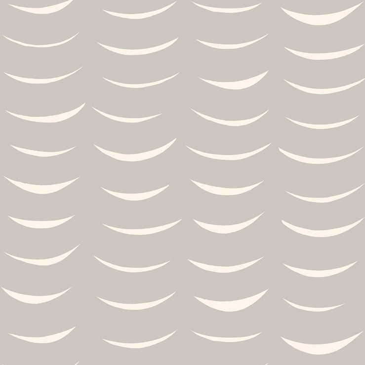 Detail of wallpaper in an abstract crescent print in cream on a gray field.