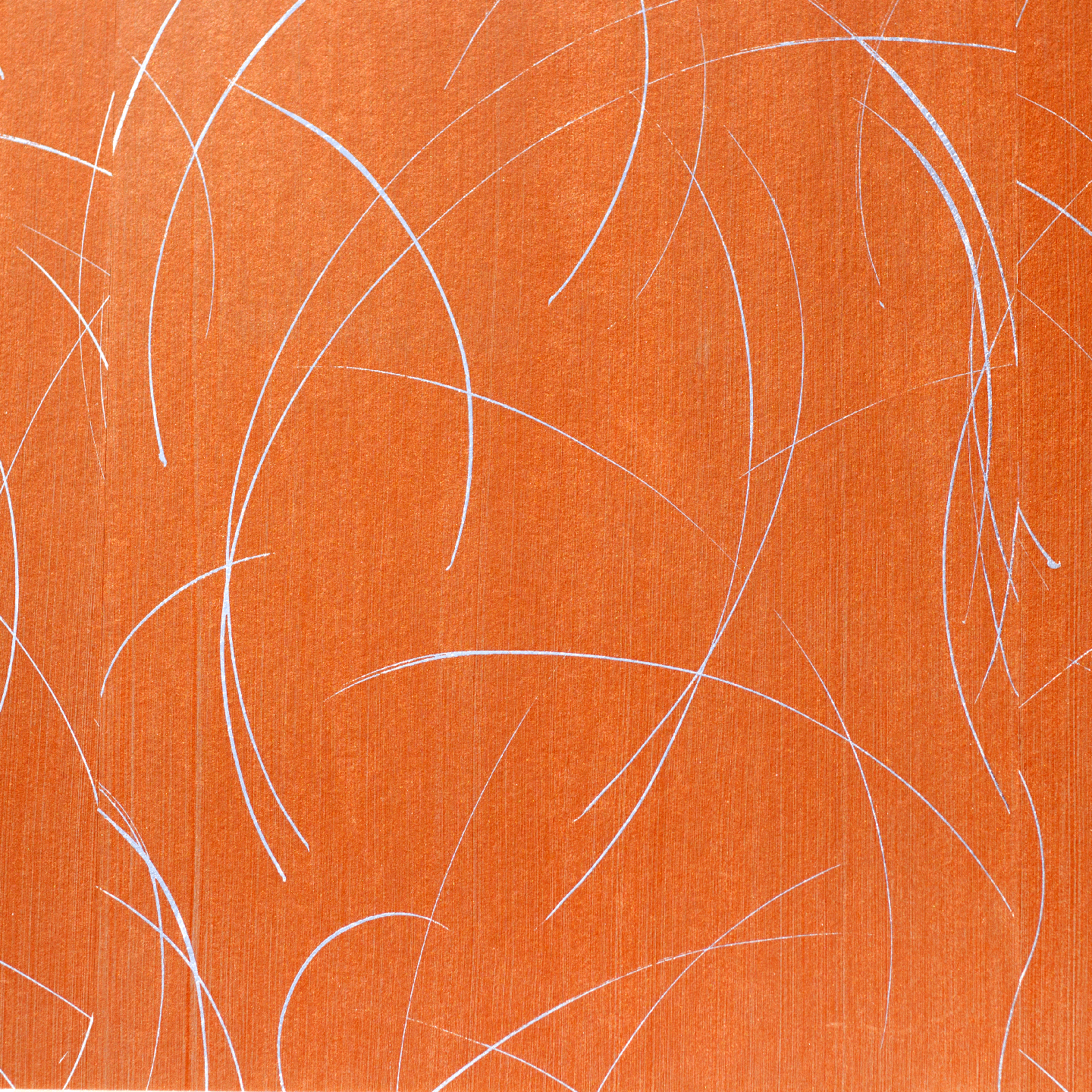 Detail of a wallpaper in an abstract curved line pattern in metallic silver on an orange field.