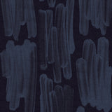 Detail of wallpaper in an abstract paint swatch print in blue on a black field.