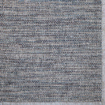 Textured broadloom carpet  with a woven pattern in shades of gray and blue.