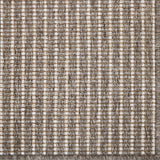 Textured rug with a striped pattern in brown and beige tones