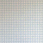 Detail of wallpaper in a dense plaid pattern in shades of light blue and cream.