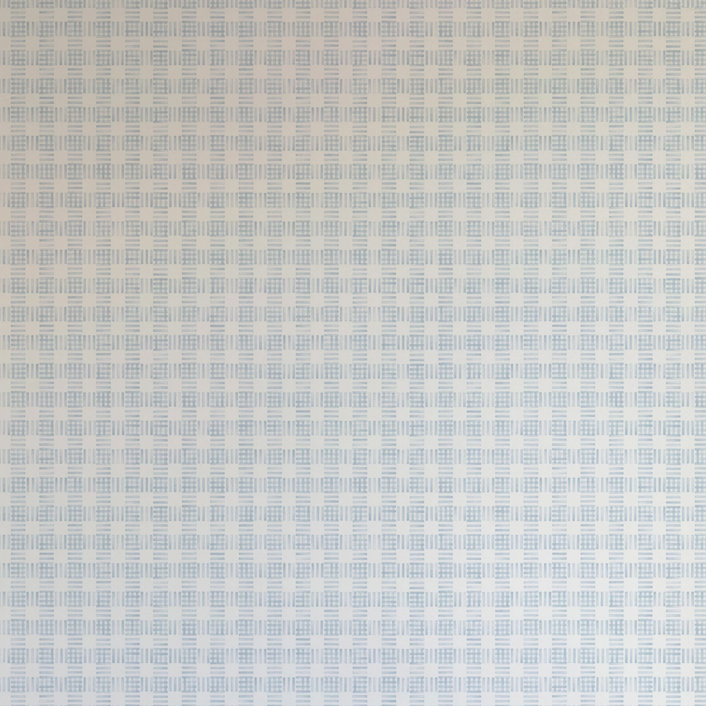 Detail of wallpaper in a dense plaid pattern in shades of light blue and cream.