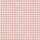 Detail of wallpaper in a dense plaid pattern in shades of cream and red.