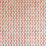 Detail of wallpaper in a playful curvy stripe print in red on a cream field.