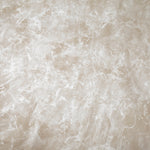 Detail of upholstery leather in cream with a marble overlay in white.