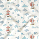 Pattern of hot air balloons and clouds on a white background