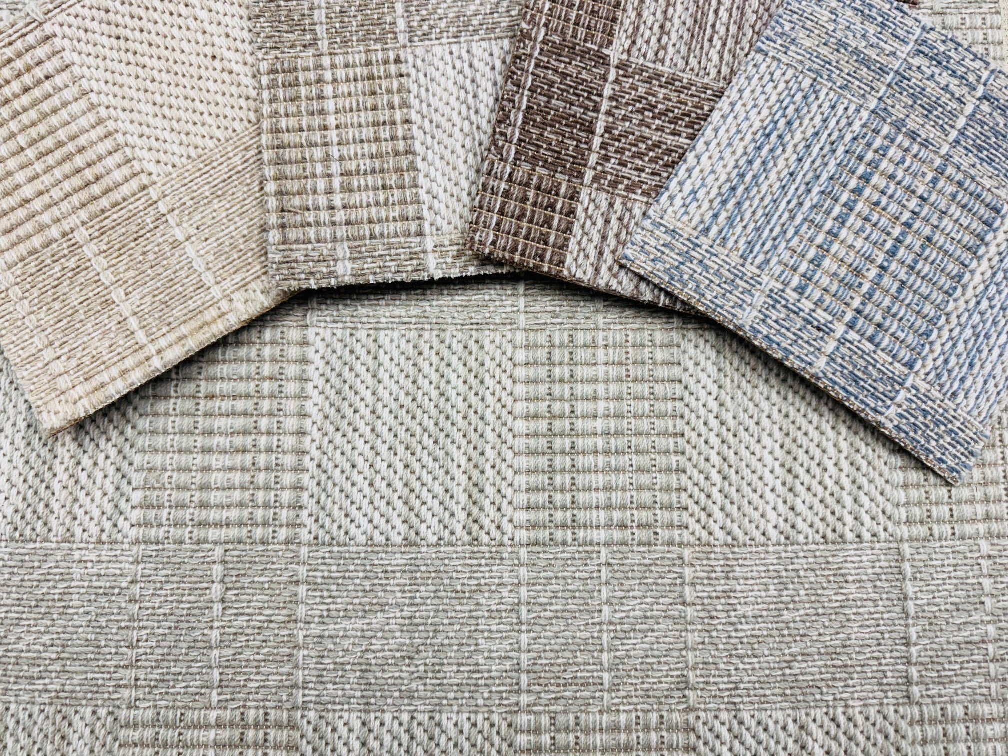Close-up of textured checkered broadloom carpet in neutral colors