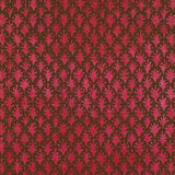 Detail of wallpaper in a repeating botanical grid print in red on a brown field.