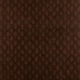 Detail of wallpaper in a repeating botanical grid print in burnt orange on a brown field.