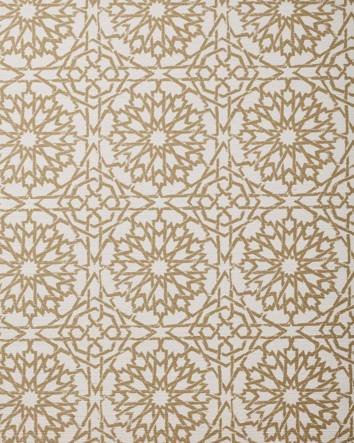 Detail of fabric in a small-scale lattice print in tan on a cream field.