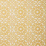 Detail of fabric in a small-scale lattice print in yellow on a cream field.