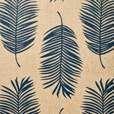 Detail of fabric in a large-scale leaf print in navy on a tan field.